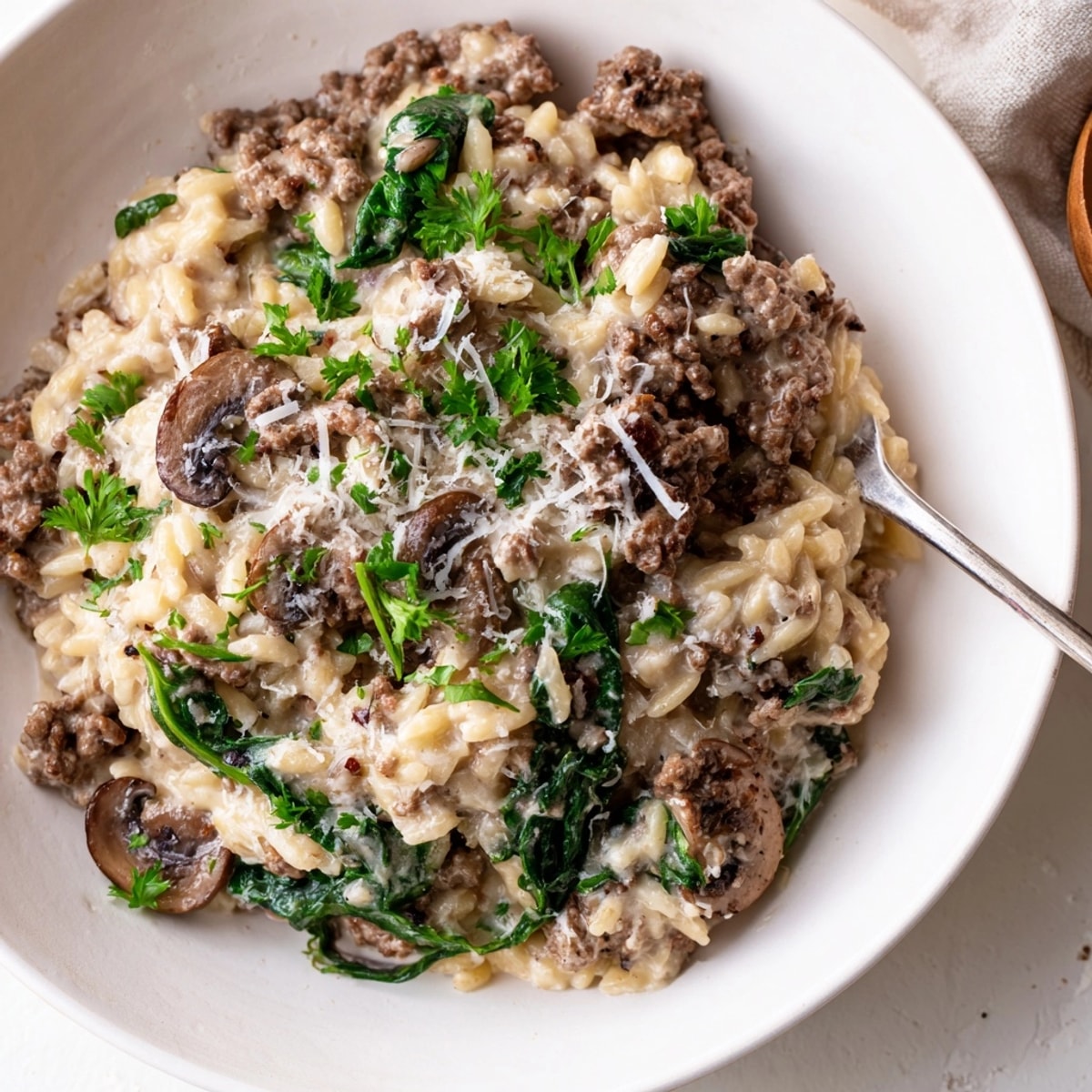 Creamy Beef Orzo: A hearty, comforting dish with tender beef, rich sauce, and fresh parsley.