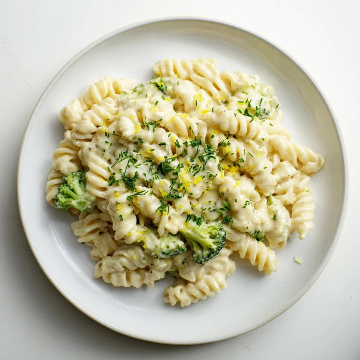 A comforting bowl of Green Goddess Broccoli Cheddar One-Pot Pasta, showcasing vibrant broccoli florets and creamy sauce.