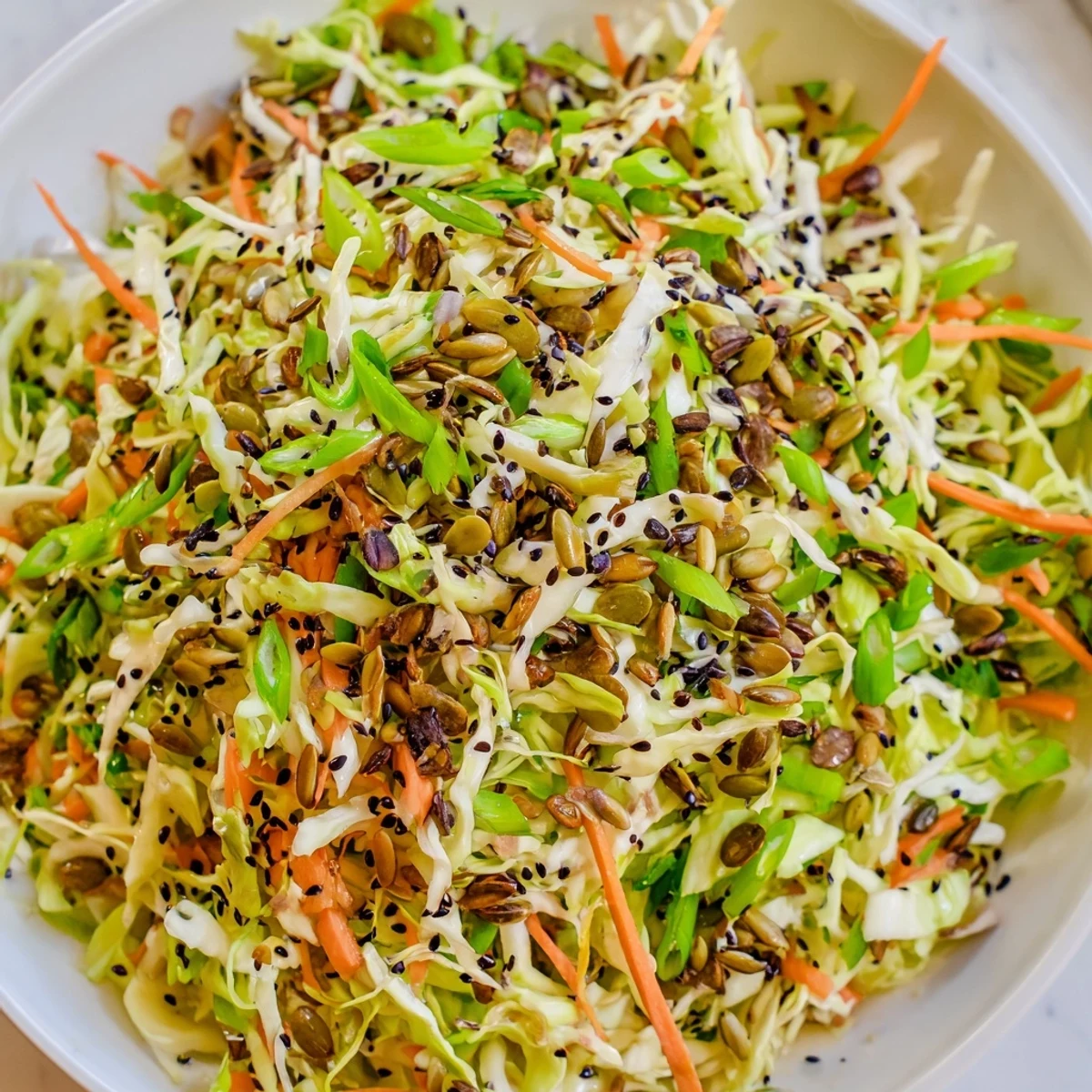 Vibrant Cabbage-Core Slaw Salad, full of crunchy vegetables and a creamy sesame dressing.