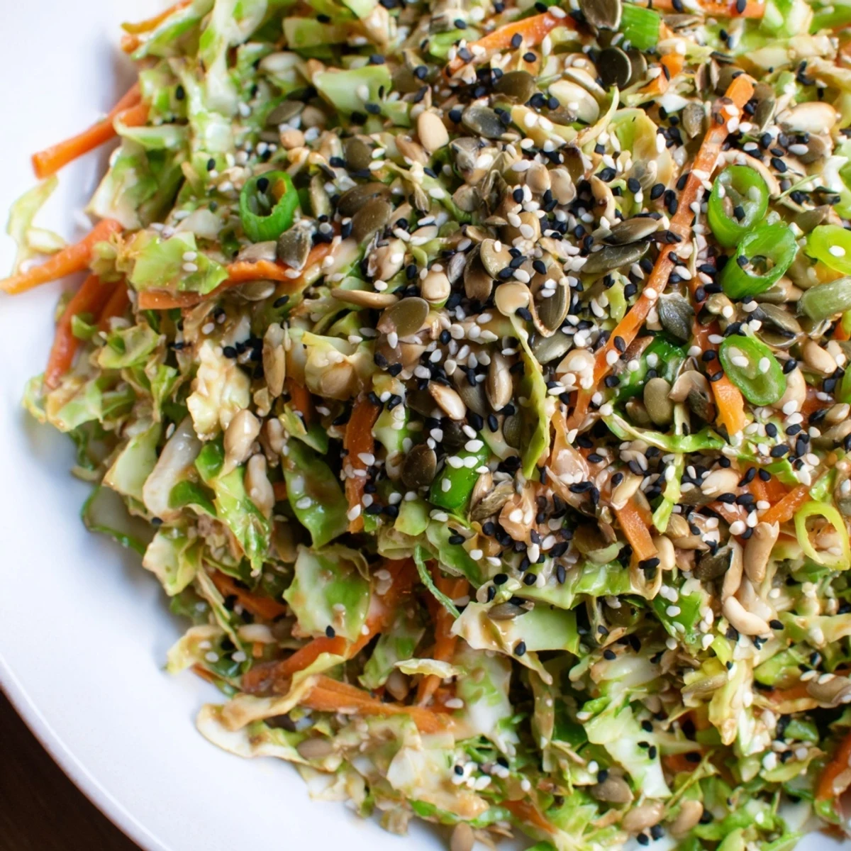 Close-up of a refreshing Cabbage-Core Slaw Salad with toasted seeds, ready to serve as a side.