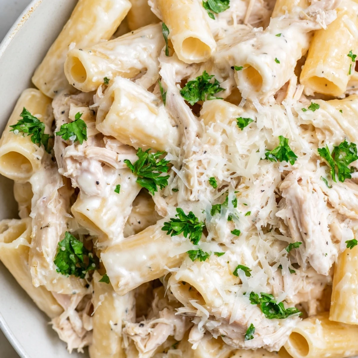 Creamy Slow Cooker Chicken Alfredo Pasta Bake, bubbling hot, ready for a satisfying, cheesy dinner.