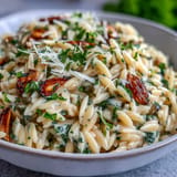 Savory roasted garlic orzo with Parmesan, ready to be served warm.