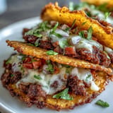 Savory burger filling meets crunchy rice shells in these Crispy Rice Burger Tacos.