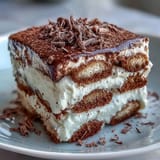 Elegant Hojicha Tiramisu, artfully dusted with matcha, a delightful coffee-free treat.