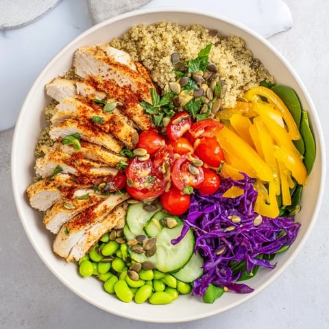 Colorful Healthy Meal-Prep Bowls packed with quinoa, grilled chicken, and fresh vegetables.  