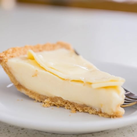 Creamy water pie with a flaky crust, perfect for nostalgic dessert lovers.  