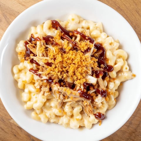 A bubbly casserole of Classic Mac & Cheese with BBQ Chicken, a delightful family meal.