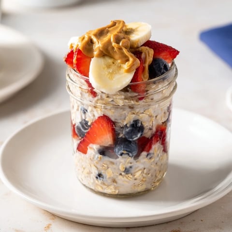A layered jar of Overnight Oats with fresh fruit and creamy peanut butter is perfect.