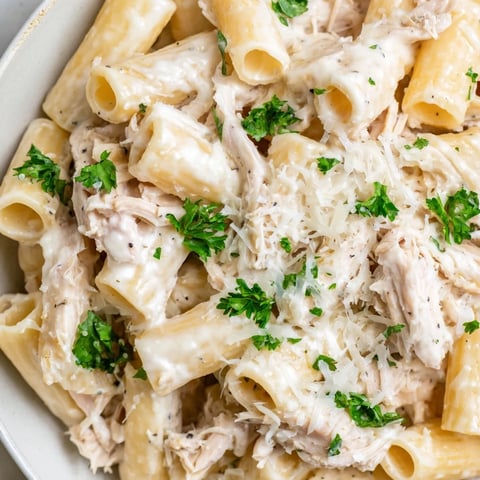 Creamy Slow Cooker Chicken Alfredo Pasta Bake, bubbling hot, ready for a satisfying, cheesy dinner.