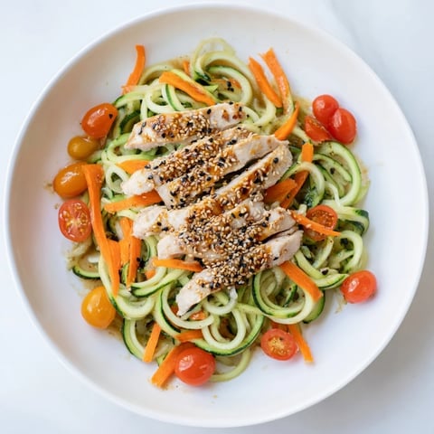 Protein Cucumber Salad with grilled chicken, vibrant colors, and creamy sesame dressing on display.