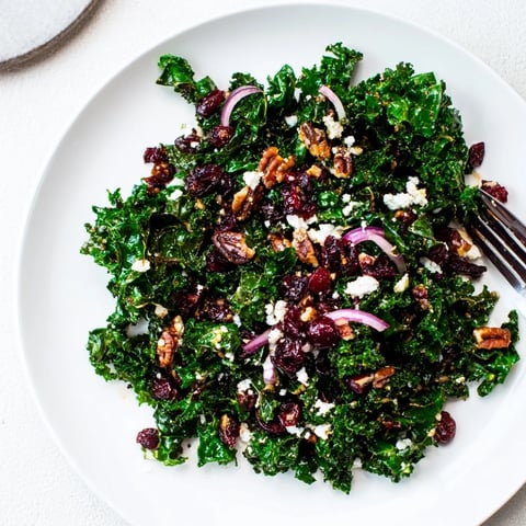Tender massaged kale with warm maple mustard dressing, topped with toasted pecans, dried cranberries, and crumbled feta.