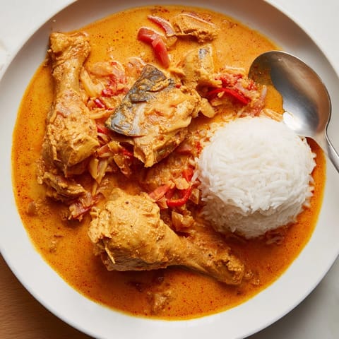 Vibrant Peanut Butter Soup in a rustic bowl; a taste of West African comfort.
