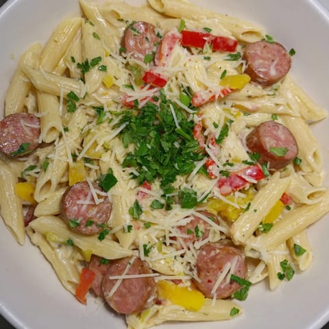 This photo shows a close-up of the flavorful Cajun Spiced Smoked Sausage Alfredo pasta dish.