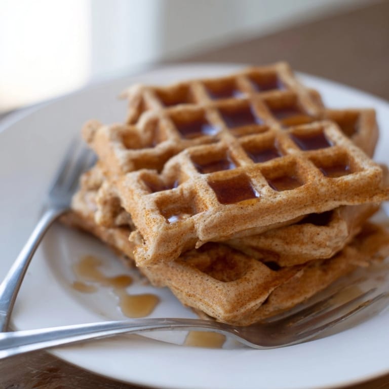 Homemade Cinnamon Vanilla Oat Waffles: a warm, spiced, oaty breakfast treat to savor.