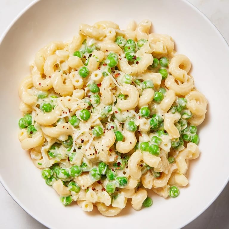 Warm, homemade Macaroni & Peas with sweet peas, perfect for a quick and easy weeknight meal.