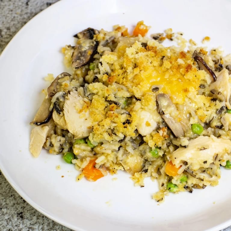 Savory Chicken and Wild Rice Bake, inviting with tender chicken and fluffy wild rice.