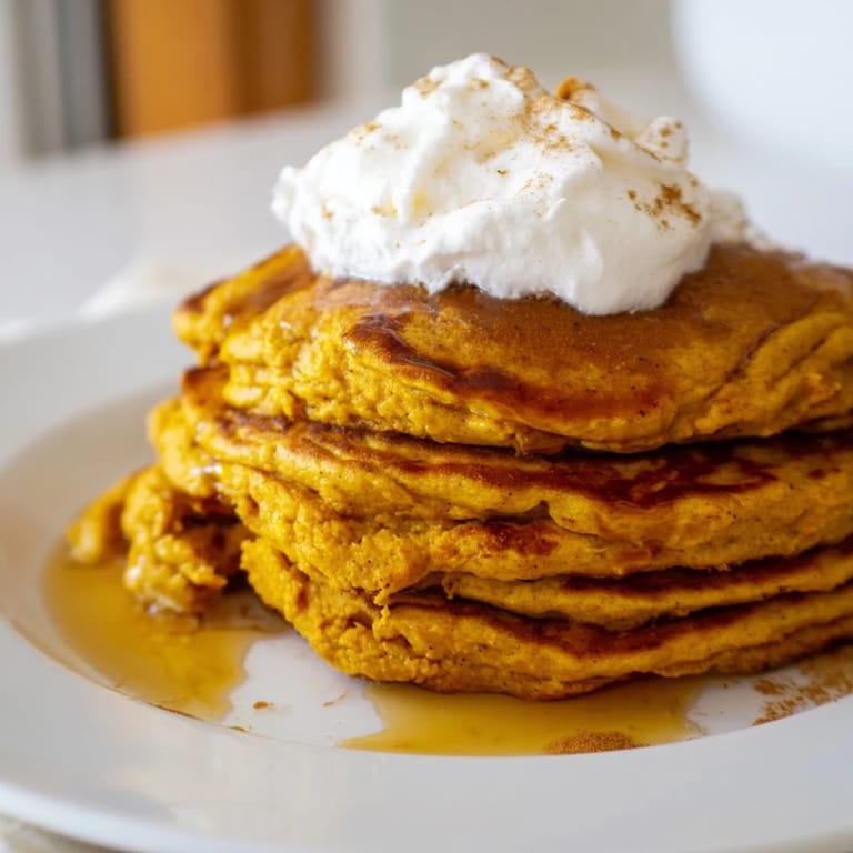 Delicious, homemade pumpkin spice pancakes, cooked perfectly, offering a taste of autumn flavors.