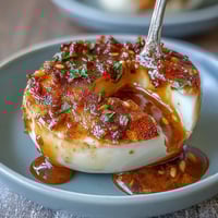 Spicy miso marinated eggs with a rich, savory umami flavor and a hint of chili heat, perfect for ramen bowls or as a protein-packed snack.