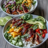 Bright Mango Chili Lime Chicken Bowls with fresh avocado, bell pepper, and cilantro.